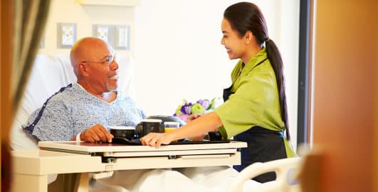 image of woman assisting man on the meal image of woman assisting man on the meal