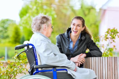 image of senior woman talking to caregiver