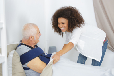 image of caregiver taking care of elderly man